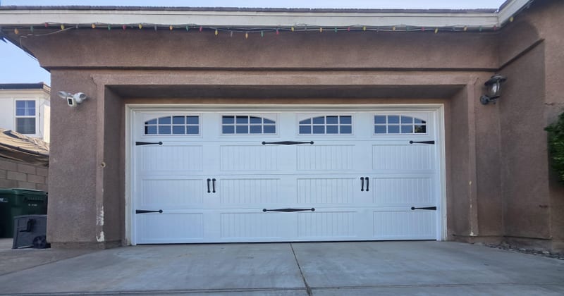 White carriage-style garage door with windows