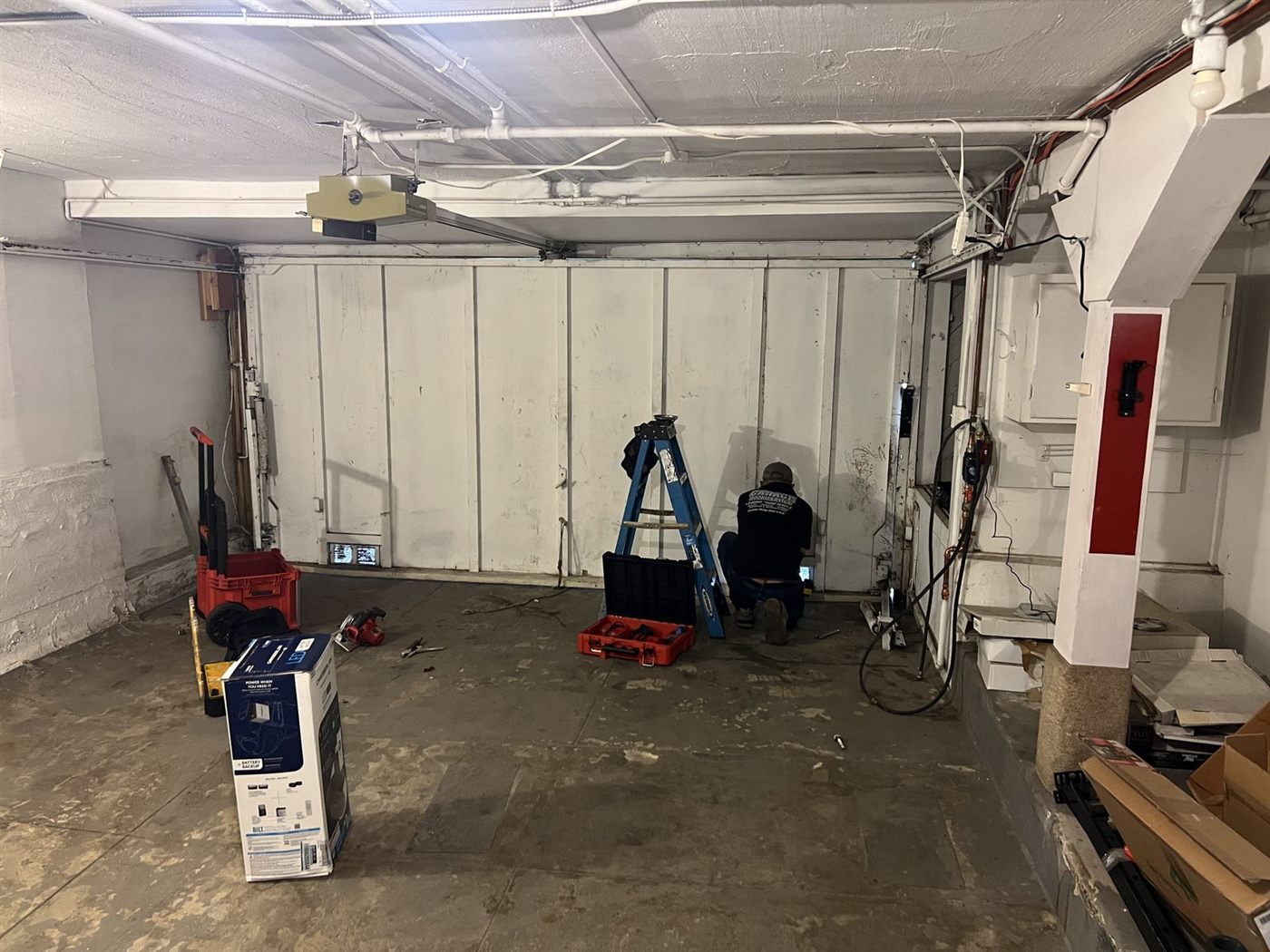 Technician working on a garage door in San Mateo